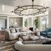 The Ritz-Carlton Orlando Grande Lakes living room with sofa, blue chairs, and large chandelier
