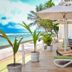 Coral Rock By Bansei in Hikkaduwa: beachfront terrace with loungers, umbrellas and ocean view