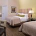 Candlewood Suites Morgantown-Univ West Virginia By IHG room with two beds, desk and kitchenette in Morgantown