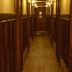 West Village Eurohostel in New York hallway with wood-paneled walls and warm ceiling lights