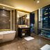 Four Seasons Hotel Shenzhen bathroom with soaking tub, vanity, and city skyline view