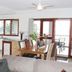 Vanuatu Beachfront Apartments in Port Vila with open-plan kitchen, dining area and balcony doors