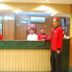 Hotel Sogo Quezon Avenue in Manila reception desk with staff in red uniforms