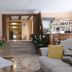Hotel Rosa Del Tirreno in Quercianella lobby with potted plants, staircase and bar area