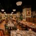 The Hollywood Grande, Autograph Collection in Los Angeles dining room with tables, chairs and warm lighting