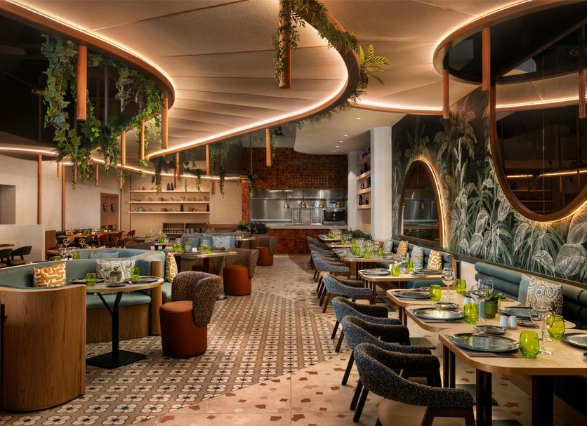 Secrets Baby Beach Aruba Adults Only restaurant interior in Sint Nicolaas with curved ceiling and tables