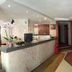 Hotel La Ronda lobby reception in Castro-Urdiales with front desk, hallway and seating