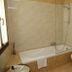 Cà Furlan Venice bathroom with bathtub, glass shower screen, toilet, and towel radiator