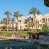 Charmillion Club Resort in Sharm el-Sheikh with palm-lined gardens and white resort buildings