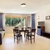 Vacancéole - Le Domaine De Chames in Vallon-Pont-d'Arc living room with large window and dining table