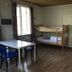 Charlottsborgs Vandrarhem in Kristianstad dorm room with bunk beds, table, chairs and window