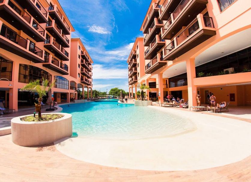 Jurerê Beach Village in Florianopolis with outdoor pool between apartment-style hotel buildings