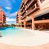 Jurerê Beach Village in Florianopolis with outdoor pool between apartment-style hotel buildings