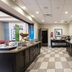 Hampton Inn By Hilton Elliot Lake breakfast area with buffet counters and checkered tile flooring