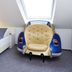 Sonnenhof in Dietzenbach room with twin beds and a vintage car-shaped chair under a skylight