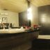 Hotel Centre Point in Nagpur bathroom with large bathtub, double sink vanity and toilet