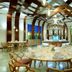 Grand Palladium Kantenah Resort & Spa in Akumal dining room with round tables and modern wood ceiling