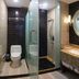 Great Wall Hotel (Yichang Cbd Food Street Store) bathroom with glass shower, toilet and vanity in Yichang