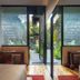 Ignacia Guest House in Mexico City guest room with open doors to a garden view