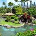 Hanalei Bay Resort in Princeville with tropical lagoon, landscaped island, and palm trees