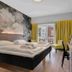 Thon Hotel Saga Haugesund room with king bed, desk, chair, wall TV and window view