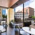 AC Hotel Fort Worth Downtown terrace with city views, tables and chairs, and lounge seating in Fort Worth