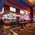 Thunder Valley Casino Resort in Lincoln, casino bar and lounge with stools, tables and illuminated ceiling