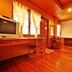 Blue Diamond Resort, Ko Tao: wood-paneled guest room with desk, chair, window, and ceiling light