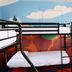 Rad Hostel in Colorado Springs bunk beds in a colorful room with a mountain mural