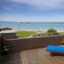 Cumberland Lorne Resort balcony with blue lounge chair and ocean view in Lorne