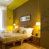 Miro Bed and Breakfast in Catania bedroom with double bed, warm lighting, and tall window
