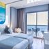 AZ Hotel Vague D'or Algiers room with sea view balcony, twin beds, and ocean-inspired wall art