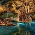 Guests floating in a cave pool at Illusion Xpress I Attraction Hotel Deluxe, Playa del Carmen