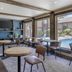 Best Western PLUS Truckee-Tahoe Hotel lobby seating with large poolside windows in Truckee