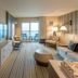 Cliff House Maine in Cape Neddick, spacious ocean-view suite with balcony and striped carpet