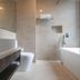 Amrise Hotel Kitchener bathroom with bathtub, toilet, and walk-in shower in Singapore