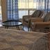 Summers Inn Ludington - Adults Only room with bed, seating area and patio door in Ludington