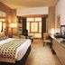 TIME Grand Plaza Hotel Dubai room with king bed, desk, TV and city-view window