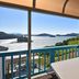 Yeosu Good Morning Pension terrace with table, blue railing, and panoramic sea and island view in Yeosu