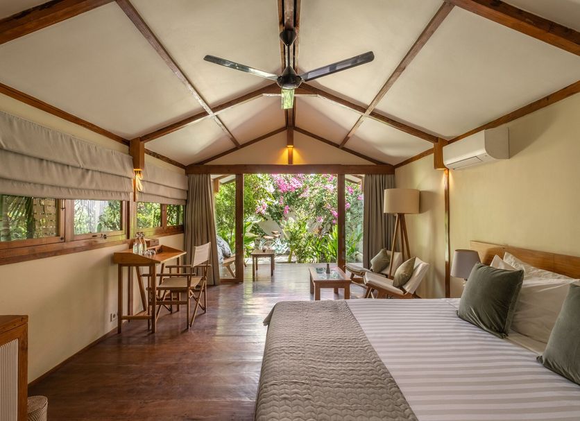 Gili Teak Beach Front Resort in Mataram, open-plan villa suite with garden-view patio and king bed