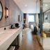 Hotel28 Myeongdong Seoul modern guest room with glass-enclosed bathroom and vanity