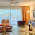 Presidential Suites by Lifestyle Puerto Plata living room with balcony and ocean view