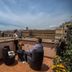Hotel Diocleziano Rome rooftop terrace with seating and city views over historic buildings
