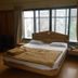 Hotel Pooja International, Nashik: guest room with double bed, large window and curtains