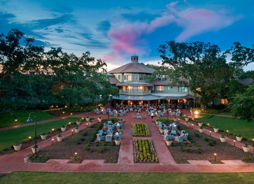 The Grand Hotel Golf Resort & Spa, Autograph Collection in Point Clear with garden patio dining at dusk