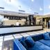 Prestige Deluxe Hotel Aquapark Club reception area in Golden Sands with blue sofas and chandelier lighting