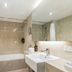 Hotel Diana Woolloongabba bathroom with bathtub, shower, sink and toilet in Brisbane