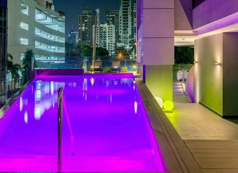 Aloft Panama rooftop pool with purple lighting and Panama City skyline views