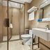 Hanting Harbin Convention and Exhibition Center Hengshan Road Branch bathroom with shower, toilet and sink