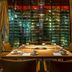Kruisherenhotel Maastricht dining room with a set table and dramatic wine cellar backdrop
